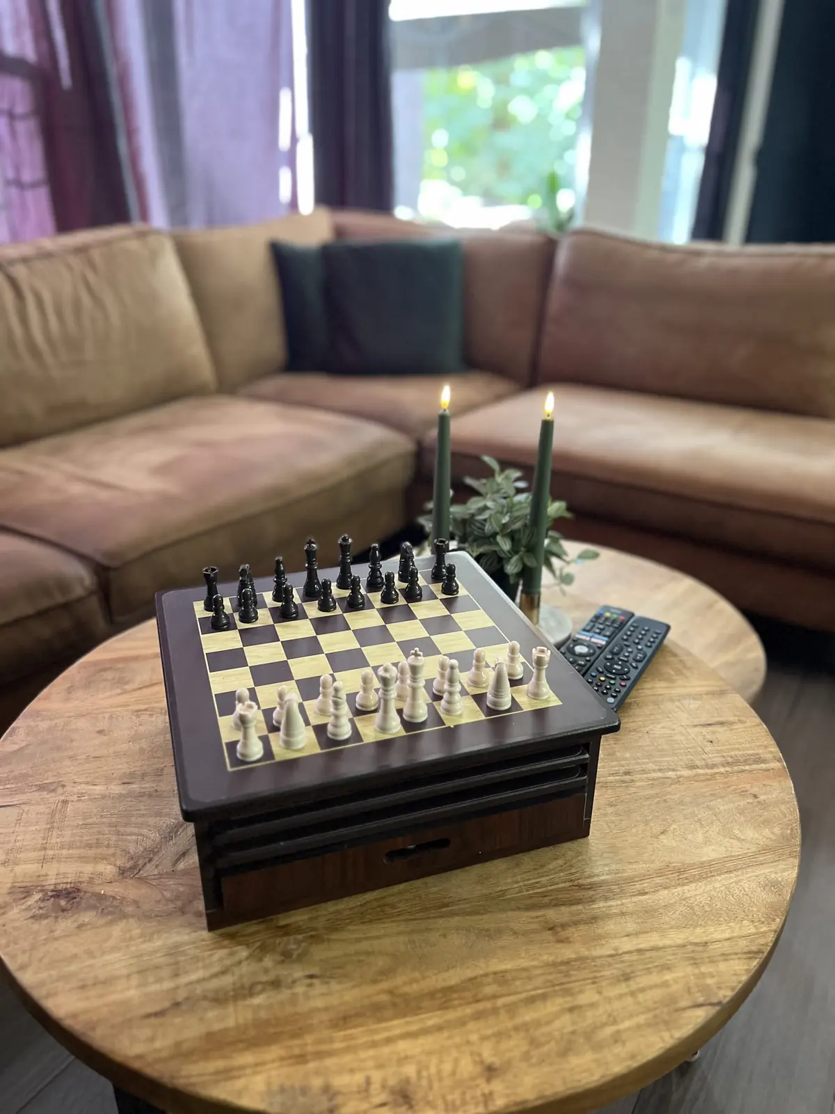 Chess set and candles on the coffee table