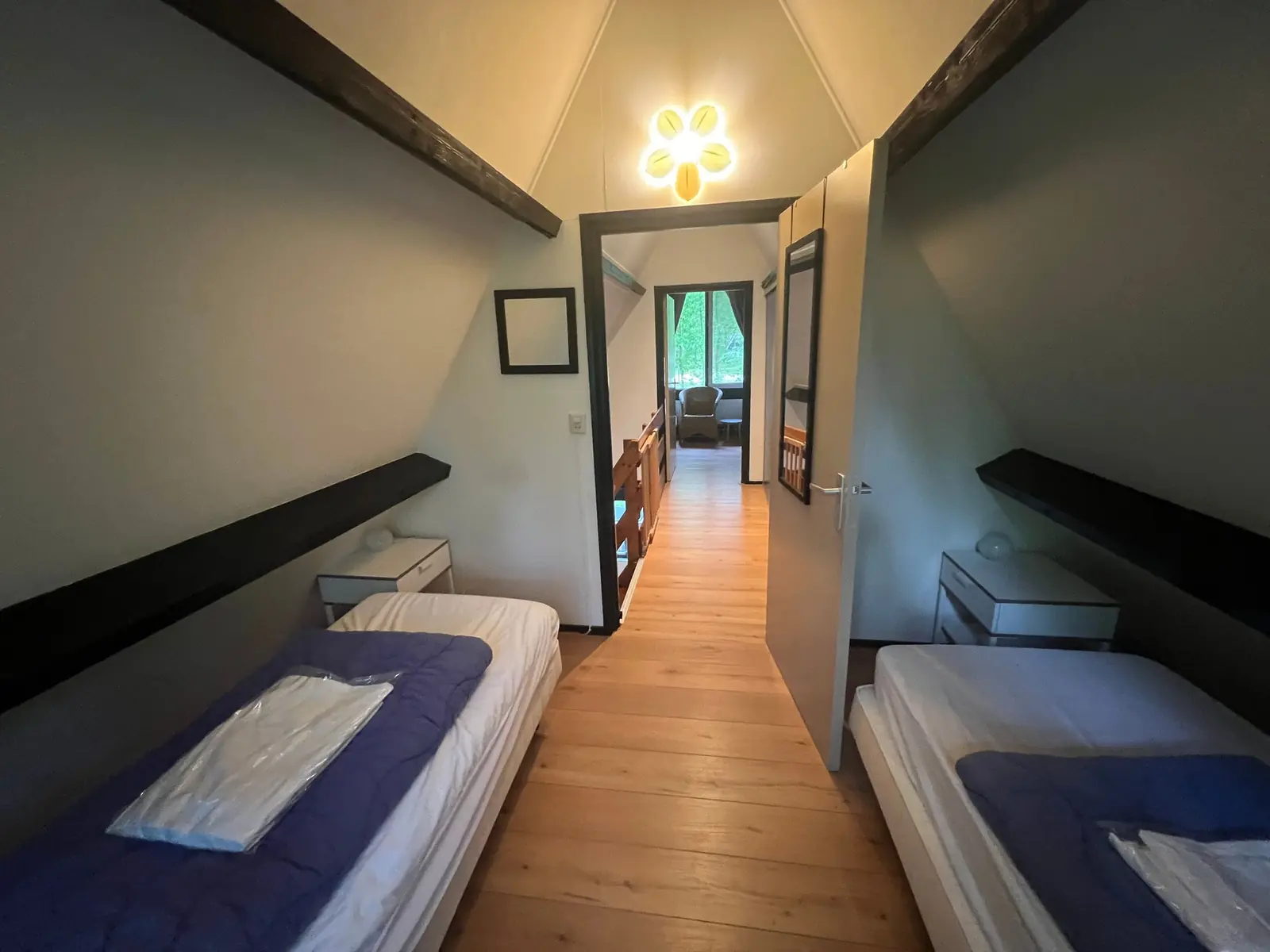 Bedroom with two single beds under the sloping walls