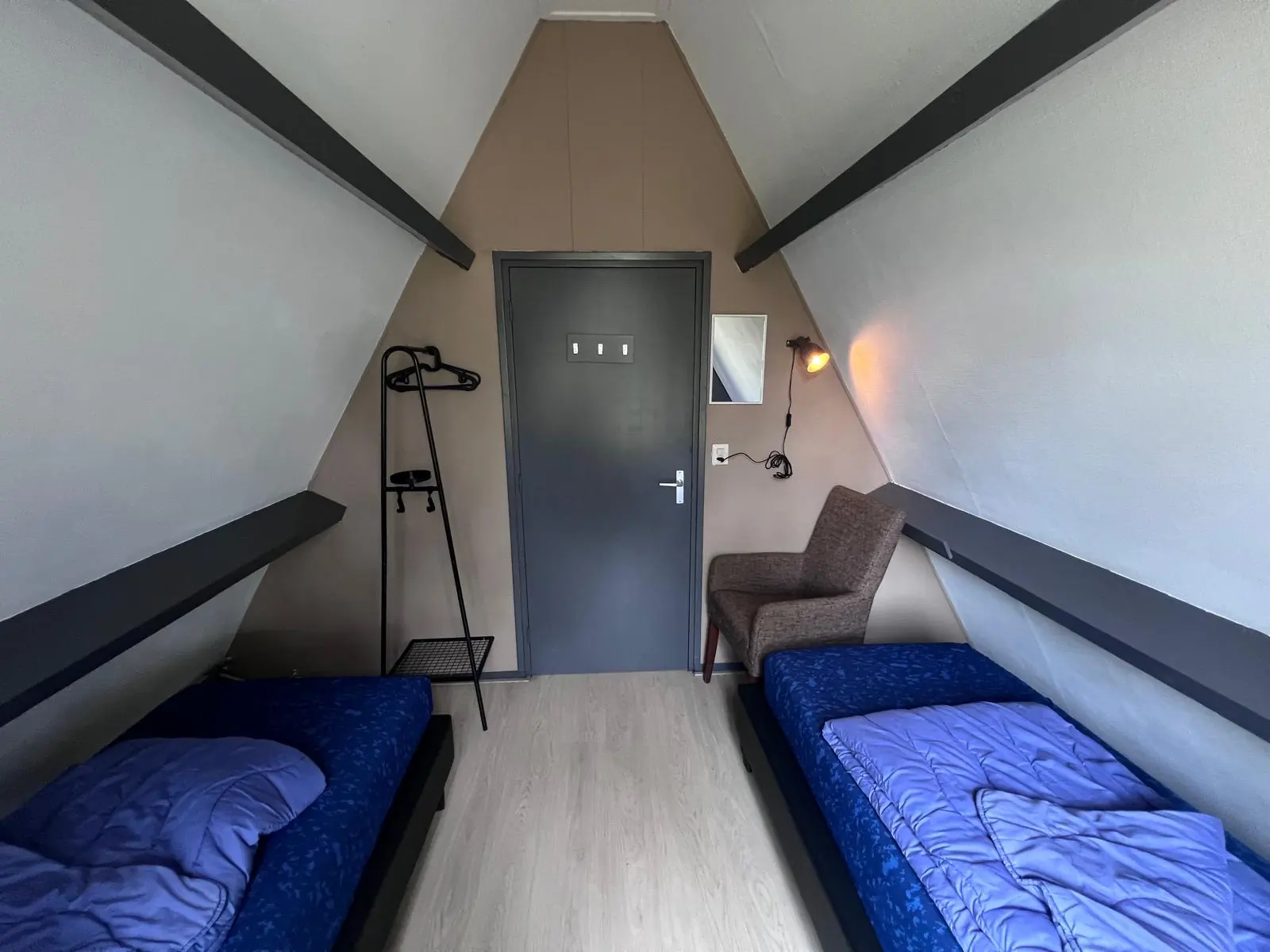Bedroom with two beds either side of the door