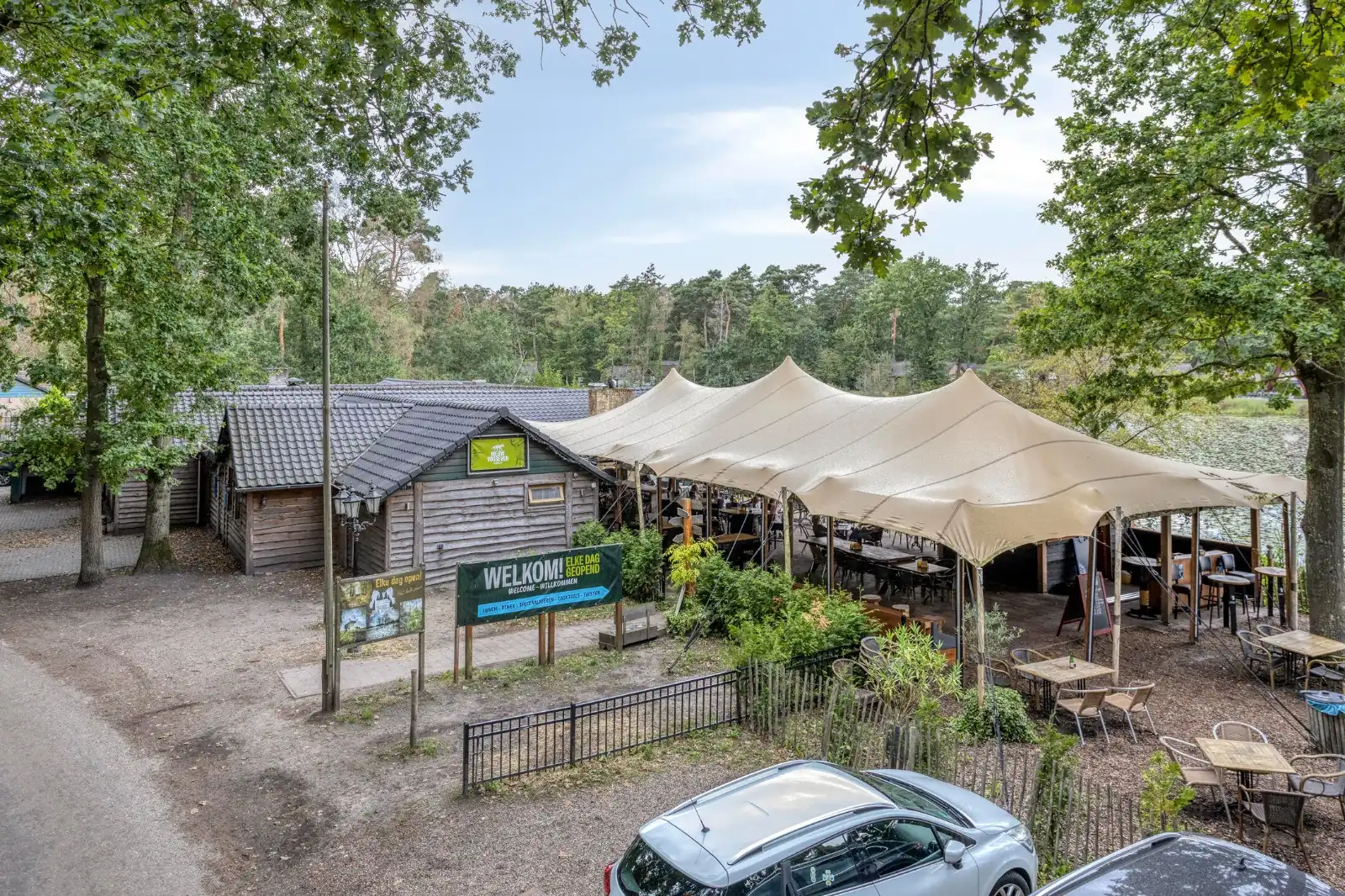 The restaurant by the park, with the terrace under the stretch tents